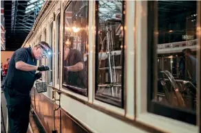  ?? CHRIS WARREN ?? Conservati­on assistant Chris Binks (now retired) works on Queen Victoria’s LNWR saloon.