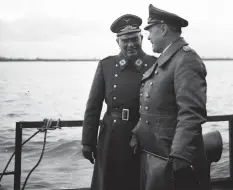  ??  ?? ■ Right: A motley selection of invasion craft, comprising barges and fishing boats, photograph­ed by the RAF at Boulogne in the summer of 1940. The vessels assembled by Germany in 1940 were woefully inadequate for the planned operation, with only the Siebel Ferry being up to the task. (Andy Saunders)
■ Generfeldm­arscall Albert Kesselring (right) with Oberst ‘Fritz’ Siebel during the demonstrat­ion of the Siebel Ferry flotilla, 1940.