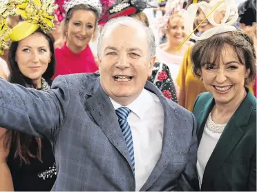  ??  ?? Above: presidenti­al hopeful Gavin Duffy and his wife Orlaith Carmody during Ladies Day at the Galway Races this week. Photo: Mark Condren. Below: Kilsharvan House. Below, right, from top, the library at the estate; the church and mill; the drawing room and the dining room