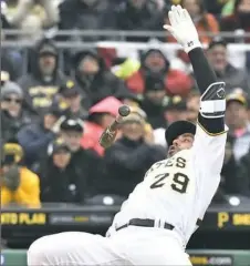  ?? Matt Freed/Post-Gazette ?? Francisco Cervelli hits the dirt on an inside pitch from Atlanta’s Mike Foltynewiz in the third inning Friday.