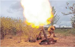  ?? REUTERS ?? A Ukrainian serviceman fires at a Russian position near Kharkiv yesterday.