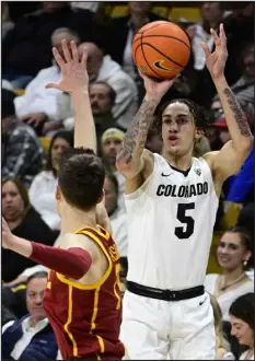  ?? CLIFF GRASSMICK — DAILY CAMERA ?? Colorado’s Quincy Allen shoots against the USC Trojans Thursday night in Boulder.