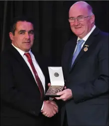  ??  ?? Louth County PRO Bob Doheny, left, with the Best Programme award for the Louth GAA Football Final which was presented by Uachtarán Chumann Lúthchleas Gael John Horan during the GAA MacNamee Awards at Croke Park.