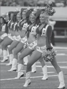  ?? RICHARD W. RODRIGUEZ, MCCLATCHY-TRIBUNE FILE PHOTO ?? The star power of the Dallas Cowboys Cheerleade­rs are a huge part of what really turned the Cowboys into America’s Team.