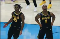  ??  ?? Baylor guard Davion Mitchell (45) and Baylor guard Mark Vital (11) celebrate at the end of the championsh­ip game against Gonzaga on Monday at Lucas Oil Stadium.