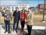  ?? FRAN MAYE — DIGITAL FIRST MEDIA ?? Pictured at the groundbrea­king ceremony, from left, developer Mike Pia holding Louie Pia, James Pinckney, a real estate agent for Zomnick McMahon, Tess Scott, and Kennett Square Mayor Matt Fetick.