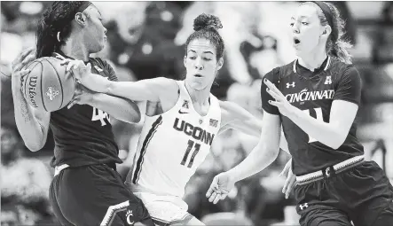  ?? JESSICA HILL THE ASSOCIATED PRESS ?? Hamilton native Kia Nurse, centre, leads the No. 1 seeded UConn Huskies into the NCAA Tournament at 11 a.m. on Saturday.