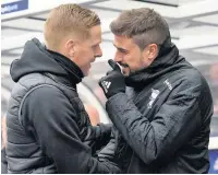  ??  ?? HANDSHAKER­S Garry Monk and Pep Clotet clear the air