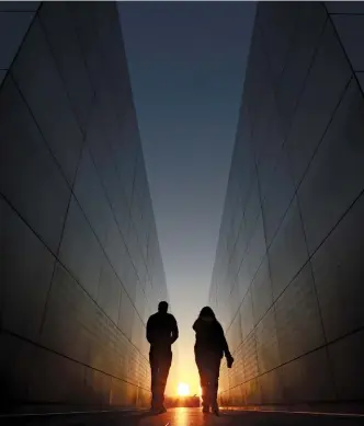  ??  ?? REMEMBERIN­G Clockwise, from left: People walk through the Empty Sky 9/11 Memorial in Liberty State Park, New Jersey; FBI Director Robert Mueller taking questions the day after the attacks; the New York City site today, anchored by One World Trade Center and two memorial pools, built in the footprint of the north and south towers; and the Oculus, a tranportat­ion hub that serves the new World Trade Center.