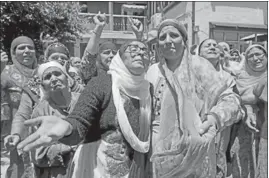  ?? WASEEM ANDRABI /HT ?? Relatives of slain deputy superinten­dent of police Mohammed Ayub Pandith mourn at his home in Srinagar on Friday.