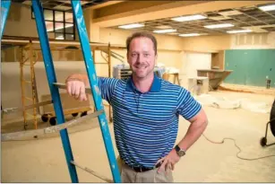  ?? RUSTY HUBBARD/TRILAKES EDITION ?? Saline Memorial Foundation Director Matt Brumley stands in the main entrance of Saline Memorial Hospital. The foundation is paying for the remodeling of the facility’s entryway.