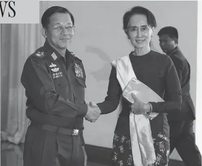  ?? SOE ZEYA TUN / AFP / GETTY IMAGES ?? A United Nations report called for the trial of Gen. Min Aung Hlaing, left, Myanmar’s army’s commander-in-chief, at the Internatio­nal Criminal Court in The Hague, and accused Aung San Suu Kyi, right, the country’s civilian leader and a Nobel Peace Prize laureate of failing to use her “moral authority” to prevent violence against the Rohingya.