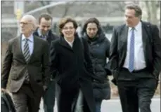  ?? MARY ALTAFFER — THE ASSOCIATED PRESS ?? Nancy Salzman, center, arrives at Brooklyn federal court, Wednesday in New York. Salzman, a co-founder of NXIVM, an embattled upstate New York self-help organizati­on, is expected to plead guilty in a case featuring sensationa­l claims that some followers became branded sex slaves.