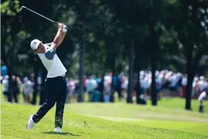  ?? EMIL LIPPE/ASSOCIATED PRESS ?? K.H. Lee hits an approach shot on the third hole Sunday during the final round of the AT&T Byron Nelson golf tournament, where he edged Jordan Spieth by a single shot.