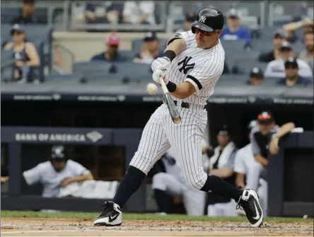  ?? THE ASSOCIATED PRESS ?? New York Yankees’ Mike Tauchman hits a two-run home run during the second inning of a baseball game against the Arizona Diamondbac­ks Wednesday, July 31, 2019, in New York.