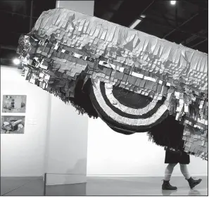  ?? AP/JAE C. HONG ?? Lowrider-inspired artwork like Gypsy Rose Pinata by Justin Favela is on display in “The High Art of Riding Low” at Los Angeles’ Petersen Automotive Museum.