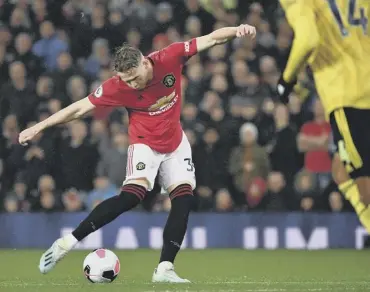  ??  ?? 0 Scott Mctominay scores the opening goal for Manchester United against Arsenal last night.