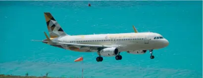  ?? — Alamy.com/ae ?? An Etihad A320 jet comes in to land at Mahe, Seychelles. Gulf investors and sovereign funds face an ever-growing number of opportunit­ies in key developmen­tal sectors in Africa. According to the Dubai Chamber of Commerce, total non-oil trade between the two regions is valued at about $24 billion, a 700 per cent increase over the last decade.