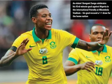  ??  ?? An elated Bongani Zungu celebrates his 93rd-minute goal against Nigeria in the internatio­nal friendly at Mbombela Stadium – his goal rescued a 1-1 draw for the home nation