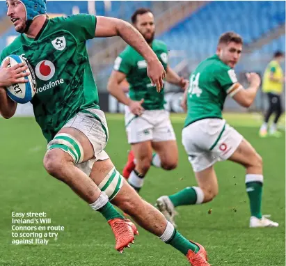  ??  ?? Easy street: Ireland’s Will Connors en route to scoring a try against Italy