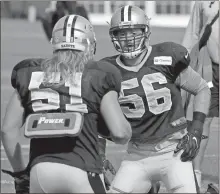  ?? File, Chris Tilley / AP ?? New Orleans Saints outside linebacker Michael Mauti (56) works with linebacker Jeff Schoetter during a drill.