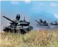  ??  ?? Armoured personnel carriers in Russian exercises involving up to 300,000 troops