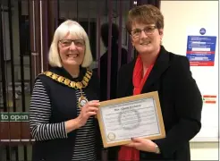  ??  ?? Alison Webster, right, receiving a Thatcham Civic Award