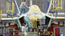  ?? FORT WORTH STAR-TELEGRAM 2015 ?? An F-35 is masked for coatings at Lockheed Martin Aeronautic­s in Fort Worth. Texas moved up six spots after tying for No. 8 in a 2017 aerospace manufactur­ing ranking.