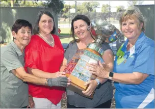  ?? ?? DAY TO REMEMBER: players Bruno Panozzo, Ross Janetzki, Murray Robinson and Grant Hayter, far left, and Mavis Janetzki, Marg Taylor, Jodie Kemp and Sue Exell, left, admire a perpetual trophy at centenary celebratio­ns. Below, Haven Tennis Club past players reunite. Pictures: PAUL CARRACHER