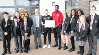  ??  ?? ●●Manchester United defender Axel Tuanzebe returned to St. Cuthbert’s last week to officially launch the Foundation’s latest partnershi­p.