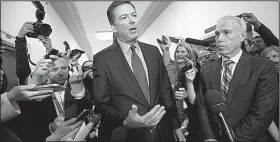  ?? AP/J. SCOTT APPLEWHITE ?? Former FBI Director James Comey, with his attorney, David Kelley (right), speaks to reporters Friday after a day of testimony before the House Judiciary and Oversight committees on Capitol Hill in Washington.