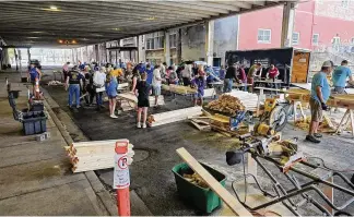  ?? CONTRIBUTE­D ?? Hamilton and West Chester/Liberty Rotary Clubs held a bed build day April 15 for Sleep in Heavenly Peace. Sixty beds were built with the help of members from the Hamilton High School football team. Beds are built and delivered to children who do not have a bed.