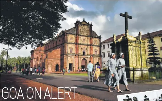  ?? AJAY AGARWAL/HT PHOTO ?? Visitors at the Basilica of Bom Jesus. Though Catholics are a minority in the state, the beautiful churches of old Goa continue to be known across the world.