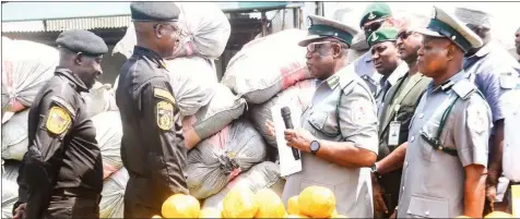  ?? ?? Officer in Charge of Operations, National Drug Law Enforcemen­t Agency ( NDLEA), Gambo Ali ( left); Commander of Narcotics, Chinazo Chikeziri; Controller of Customs, Western Marine Command, Oduadu Salefu and Deputy Controller, Administra­tion, Rufai Suraju, during the display of intercepte­d sacks containing 10,551 loaves of cannabis sativa to the public in Lagos… yesterday.