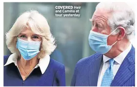  ??  ?? COVERED Heir and Camilla at tour yesterday