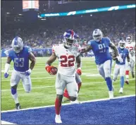  ?? Duane Burleson / Associated Press ?? New York Giants running back Wayne Gallman, chased by Detroit Lions linebacker Trevor Bates (53) and defensive tackle A’Shawn Robinson, runs into the end zone for an 11-yard touchdown during the second half of a preseason game on Friday.