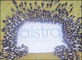  ??  ?? Employees mill around the giant Alstra logo.