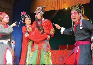  ?? AFP ?? Actors from the Jinyuan Opera Company perform in a temple in White Horse town in Daying, in China’s southwest Sichuan province, on November 19.