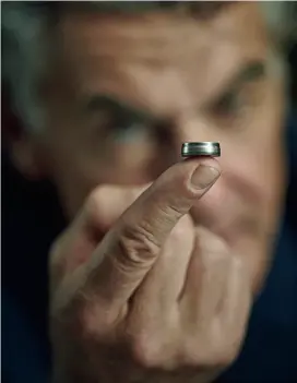  ??  ?? Micro Marvel
Michael Tojner balances Varta’s CoinPower battery on his index finger. The tiny device weighs less than an ounce and is the size of four stacked dimes.