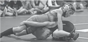  ?? KURT SNYDER/THE ADVOCATE ?? Johnstown’s Calhan Rader wrestles Northridge’s Mason Burgel at 52 pounds during a youth match at Northridge Elementary. Both programs are growing, but that growth is beginning to strain their facilities.