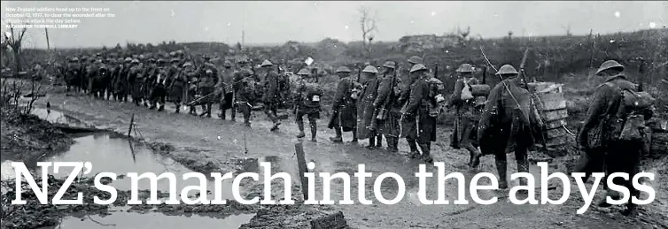  ?? ALEXANDER TURNBULL LIBRARY ?? New Zealand soldiers head up to the front on October 13, 1917, to clear the wounded after the disastrous attack the day before.