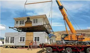  ?? ?? The Peakes moved this two-storey home from Christchur­ch to Lowburn, Central Otago.