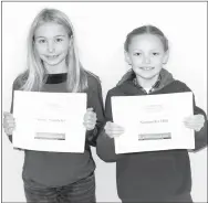  ?? Westside Eagle Observer/MIKE ECKELS ?? Samantha Hill (right), winner, and Alexis Standefer, runner-up, display the certificat­es they earned during the 2017 Decatur Northside Elementary spelling bee on Dec. 1.