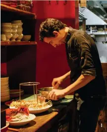  ??  ?? 4 Chef Julien Lecomte preps the Seafood Platter, delicately placing the shellfish on a bed of ice