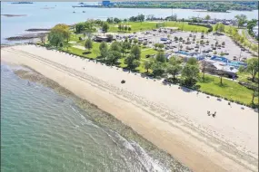  ?? Patrick Sikes / For Hearst Connecticu­t Media ?? A drone view of Calf Pasture Beach in Norwalk last May. A New Haven lawmaker has introduced a bill that would stop Connecticu­t municipali­ties from charging high fees to non-residents to use their beaches.