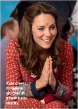  ??  ?? Kate greets homeless children at a New Delhi charity.