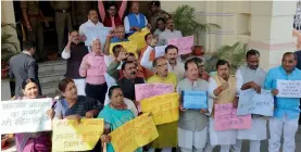  ?? — PTI ?? BJP MLAs demonstrat­e outside the Bihar Assembly in Patna on Wednesday to condemn prohibitio­n minister Abdul Jalil Mastan’s anti-PM comments.