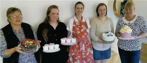  ??  ?? ●● Volunteers from the Macclesfie­ld branch of Cakes for kids with some of their creations