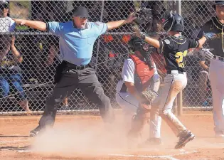  ?? GREG SORBER/JOURNAL ?? Eastdale’s Ty Mancha (23) mimics umpire Collin Campbell’s safe sign after he successful­ly stole home ahead of the tag of Shorthorn catcher Garret Tucker on Sunday.