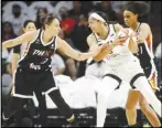  ?? Associated Press ?? Chicago Sky forward/center Candace Parker looks to pass as Phoenix Mercury guard Diana Taurasi (3) defends during the first half of game 1 of the WNBA basketball Finals on Sunday.